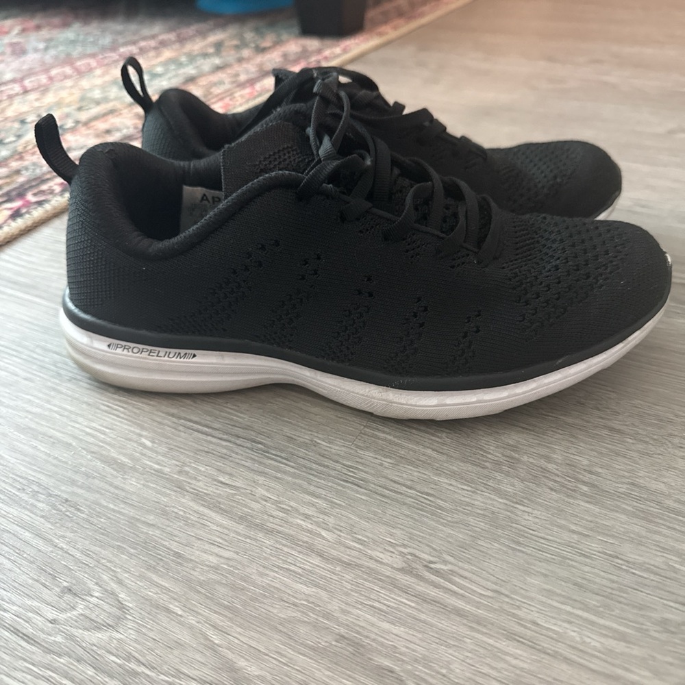 APL women’s techloom black sneakers, size 9